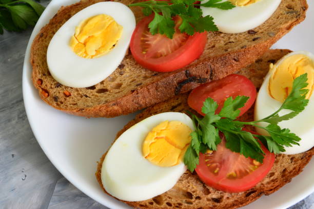 istock sandwiches with eggs, tomatoes and parsley, close up 1349004423
