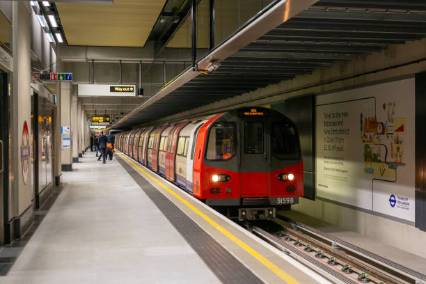 Nine Elms Northern The first train in passenger service along the Northern Line Extension, TfL's latest extension to the London Underground, is seen arriving at Nine Elms en-route to Battersea Power Station wandsworth photos stock pictures, royalty-free photos & images