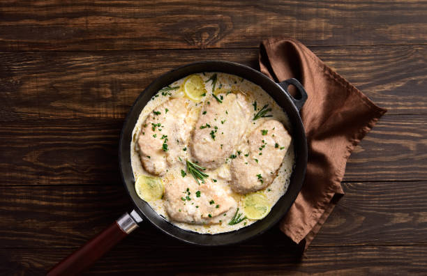 istock Chicken breast in creamy garlic sauce 1349006620