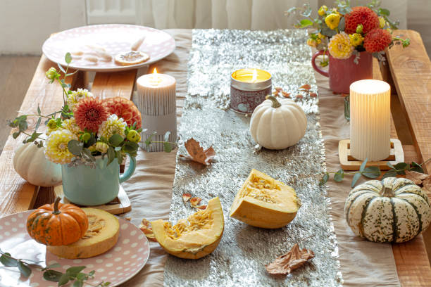 istock Festive table setting with pumpkins and chrysanthemum flowers. 1349008621