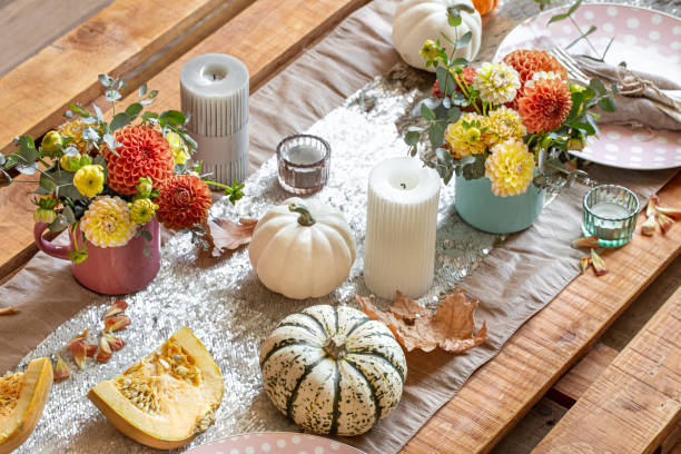 istock Festive table setting with pumpkins, candles and chrysanthemum flowers. 1349008630