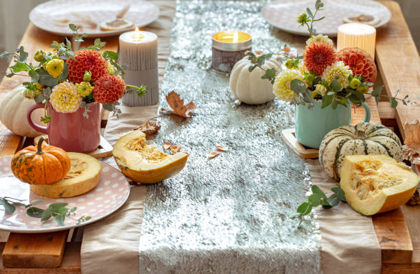 istock Festive table setting with pumpkins and chrysanthemum flowers. 1349008631