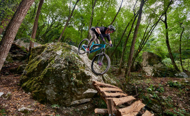 istock Enduro biker on a self-constructed challenging trail in the woods 1349010171