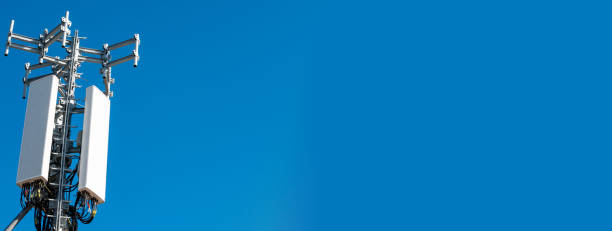 istock Telecommunications tower, antenna and blue sky banner 1349010613