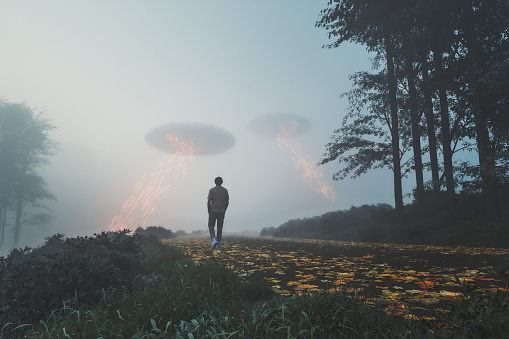 Man walking towards UFOs on the rural road, 3D generated image.