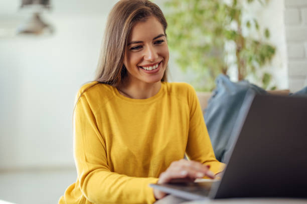 istock Adult woman, using her new laptop. 1349013872