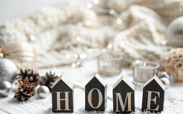 istock Cozy winter background with decorative wooden word home. 1349013890