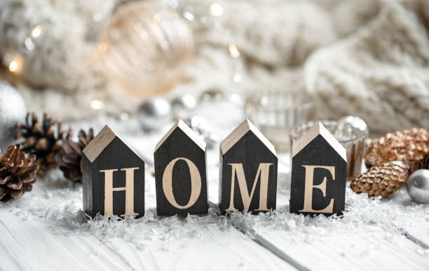 istock Cozy winter background with decorative wooden word home. 1349013896