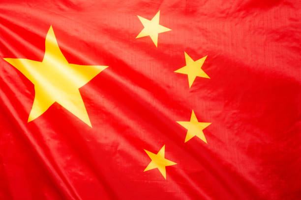 istock China flag waving as a background. 1349014131