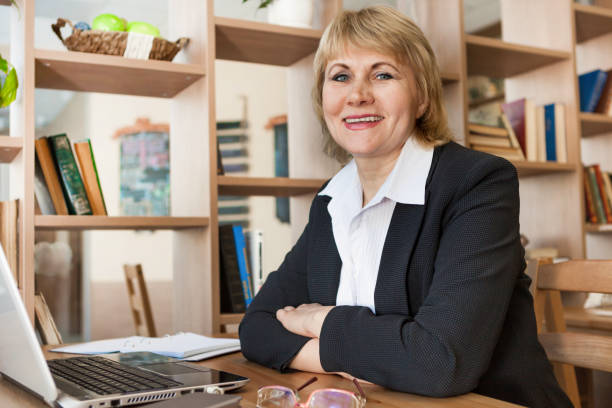 istock Woman in cafe and office working with laptop 1349015116