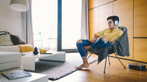 istock Robot vacuum cleaning for cozy home office 1349015218