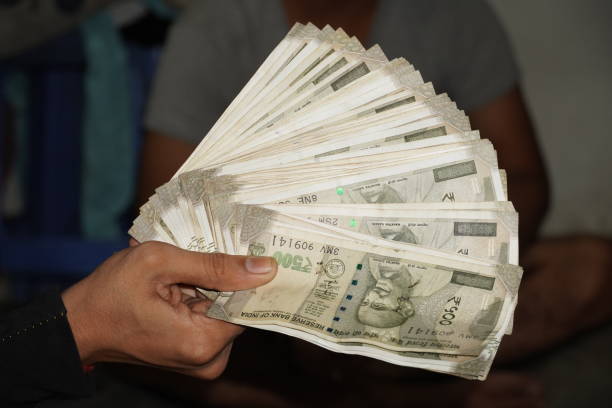 istock indian 500 notes images in hand 1349015435