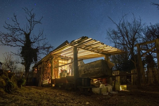 Henhouse at farm under stars in the winter night, Germany Henhouse at farm under stars in the winter night, Germany winter chicken coop stock pictures, royalty-free photos & images