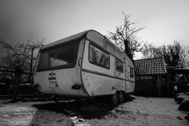 istock Old camping trailer standing at a farm at night in winter, Germany 1349017246
