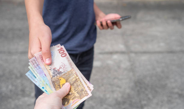 istock Cash Business Concept - Money Changing Hands 1349021095