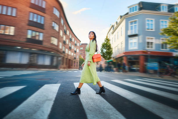 istock Young woman crossing road 1349021496