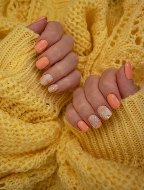 istock female hands beautiful manicure warm fabric sweater yellow 1349021805