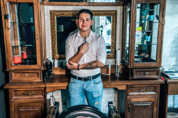 istock Barber in his vintage barber shop 1349023041