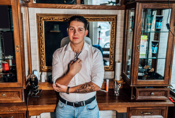 istock Barber in his vintage barber shop 1349023407