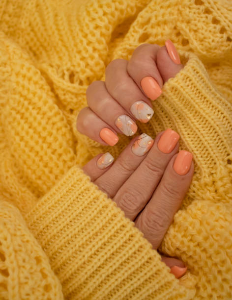 istock female hands beautiful manicure warm fabric sweater yellow 1349023568