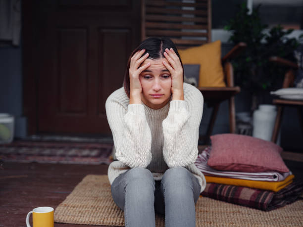 Young depressed asian woman sitting on porch of backyard. Young depressed asian woman sitting on porch of backyard. She feeling sad and worried suffering depression in mental health. Mental health, anxiety depressed thinking chinese lady. sadness stock pictures, royalty-free photos & images