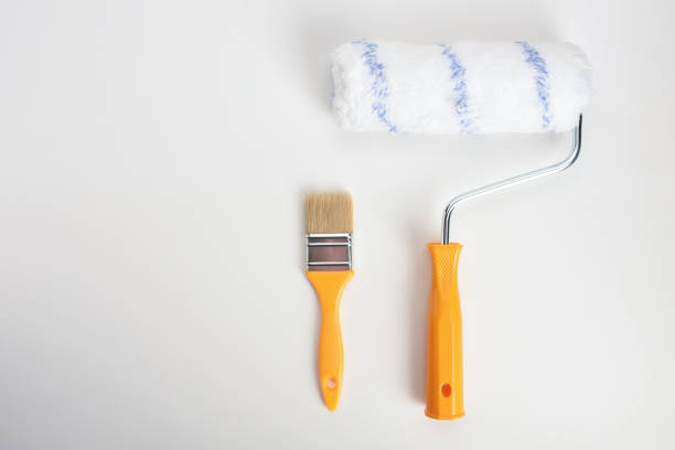 istock Paint roller and paintbrush on the white background 1349024756