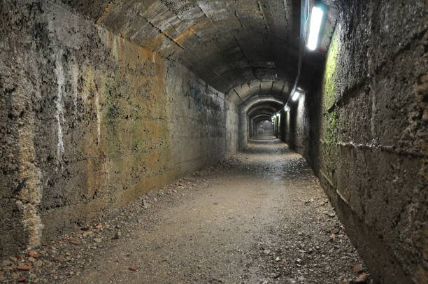 istock A tunnel used in World War II, illuminated and long 1349026513