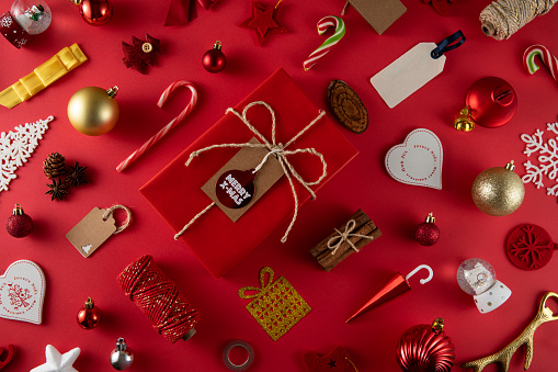 Christmas related objects and ornaments on red background