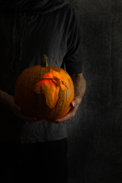 istock Halloween pumpkin carved and illuminated. 1349028051