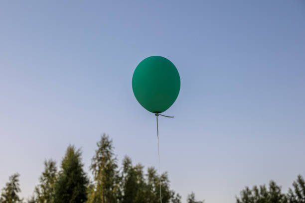 Boy holding balloons