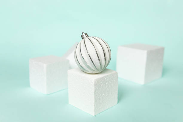 istock Simply minimal composition winter objects ornament and cube shapes geometric form podium isolated blue pastel background. Christmas New Year december time for celebration concept. Mockup, copy space 1349030291