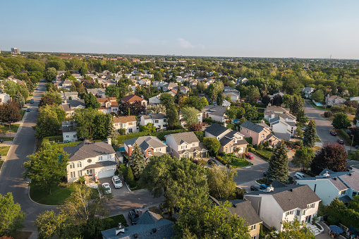 Aerial view of houses and streets in beautiful residential neighbourhood in Montreal, Quebec, Canada, North America. Property, homes and real estate concept, summer season.