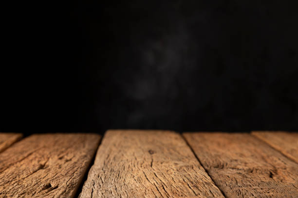 istock Rustic wooden table on dark background. Texture for black friday. 1349032201