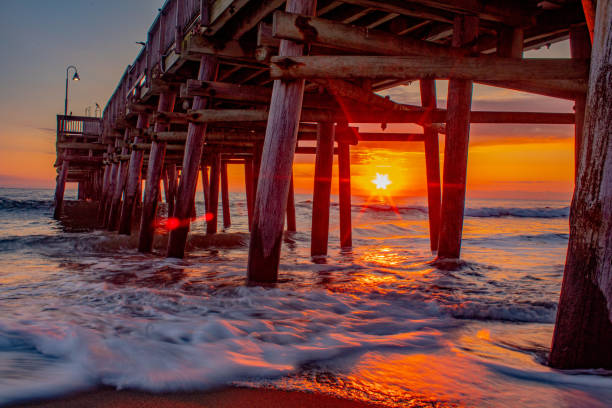 istock Sunrise at the Sandbridge Beach pier 1349035028