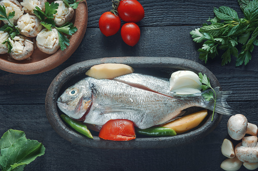 Sea bream and ingredients for cooking and seasoning