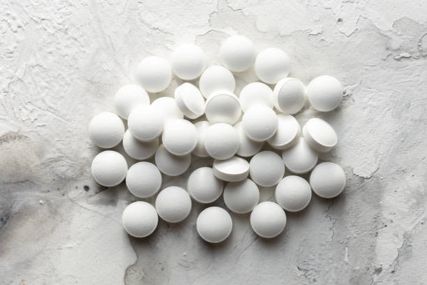 istock A handful of pills scattered on the table 1349036746