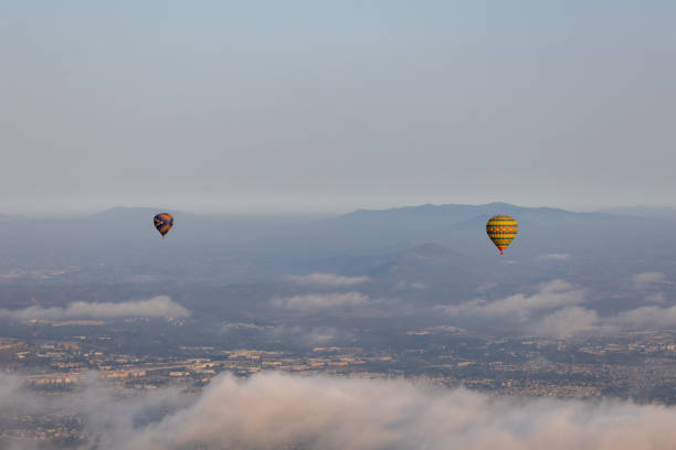 istock two hot air balloons on blue sky over the clouds 1349042087
