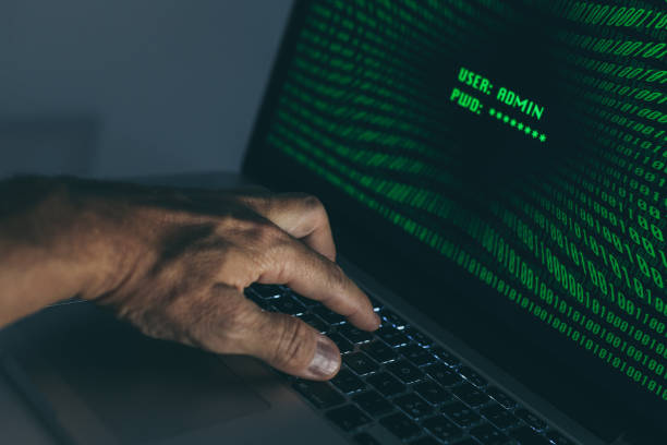 istock Hand typing on a laptop keyboard green numbers on display. Successful login with credentials user and password in the system. Technology communication, security protection, hacker, cyber crime concept 1349043220