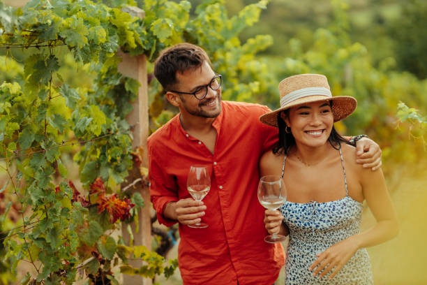 istock Couple tasting wine in the vineyard 1349049437