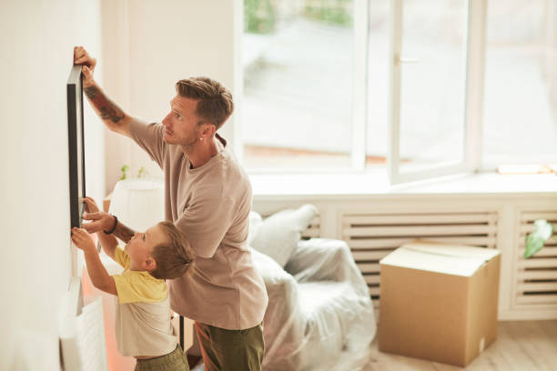 istock Father and Son Hanging Picture 1349049518