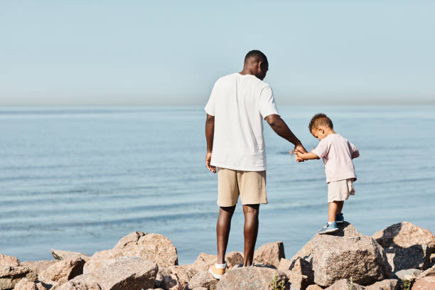 istock Father with Baby Son at Beach 1349050049