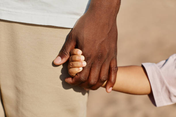 istock African American Father and Son Holding Hands 1349050050