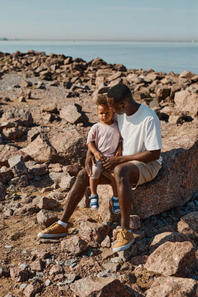 African American Father and Son at Beach