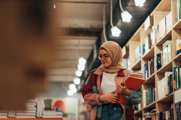 Young student woman in library