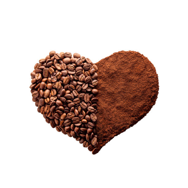 Coffee heart shape by powder and beans isolated on white background