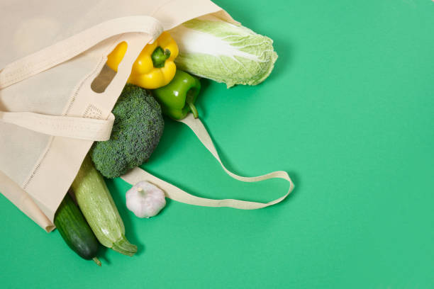 istock cloth shopper with vegetables on a green background 1349061935