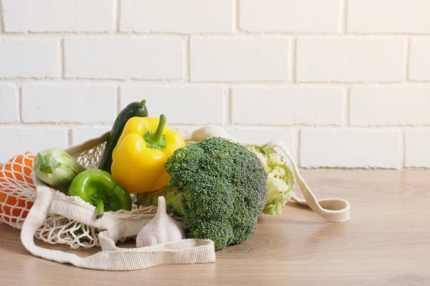 istock eco bag with food items on a wooden kitchen table 1349061945
