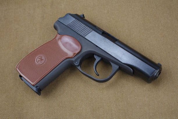 istock 9mm soviet handgun on USSR khaki uniform Soviet–Afghan War (1979-1989) era 1349062986