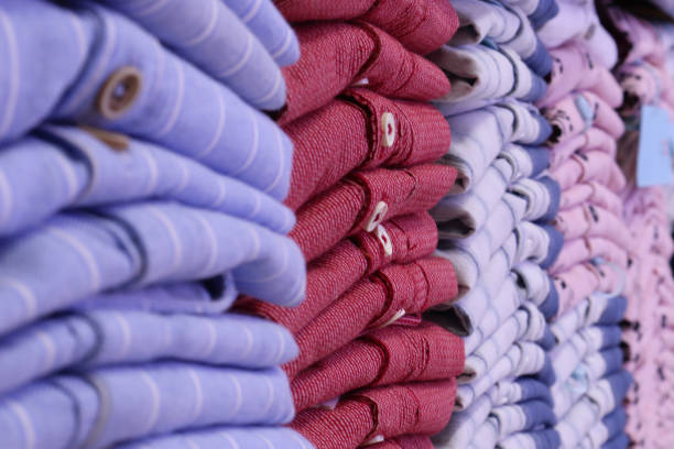 istock stack of colorful folded shirts on the rack 1349063965