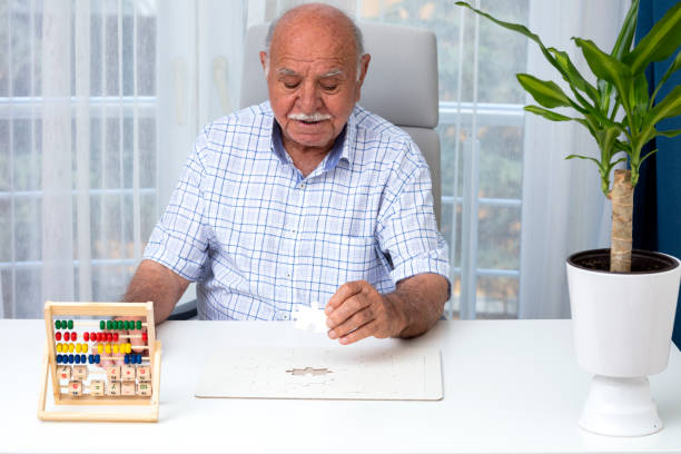istock Elderly man make exercise why she is protected Alzheimer's disease 1349066227